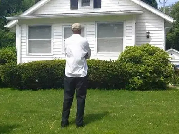 Man admiring his new home 